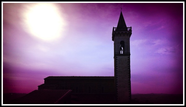 A beautiful bell tower with purple blue sunrise over vince