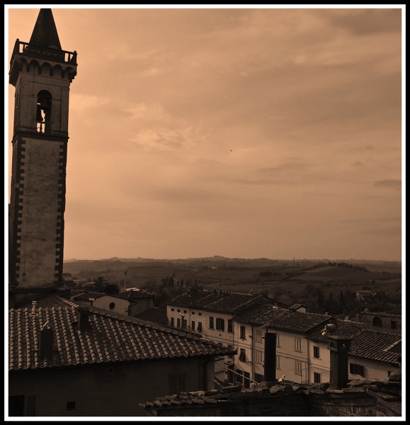 A view overlooking the town of Vinci with a bell tower on the left