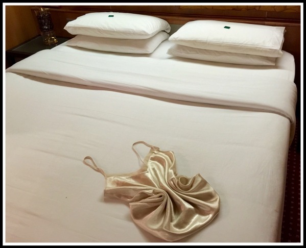 a photo of the folded bed covers and Sarahs Folded Nightie 2