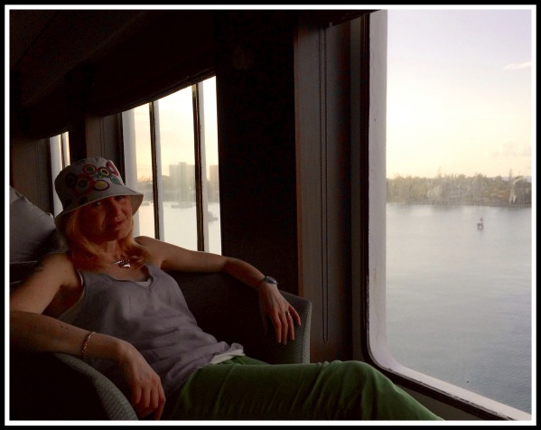 Sarah relaxing in the Coffee Port on deck 8 with a lovely view of Montego Bay, Jamaica through the windows