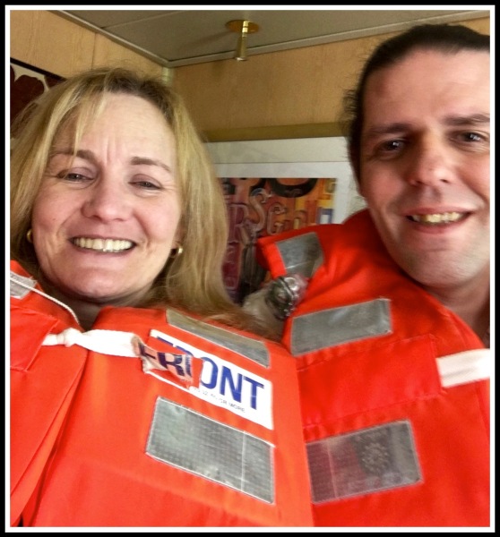 A selfy of Sarah and i wearing our orange life jackets