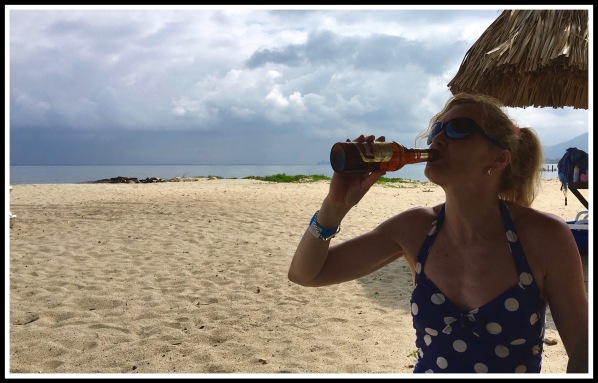 Sarah drinking lager on Trujillo beach