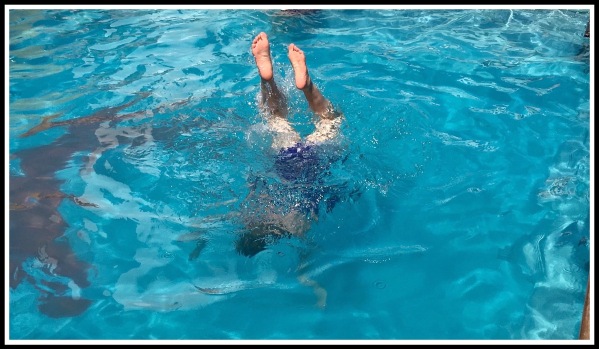 Sarah doing handstands in the swimming pool on the ship....Herr feet and legs are outside the water sticking up and her body is underwater!