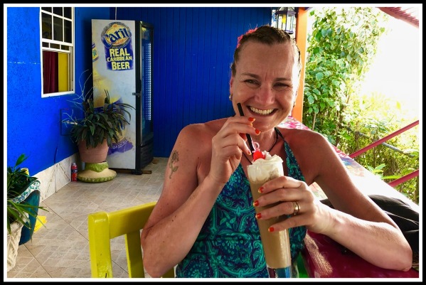 Sarah drinking an iced coffee in Sharkey's Barbados