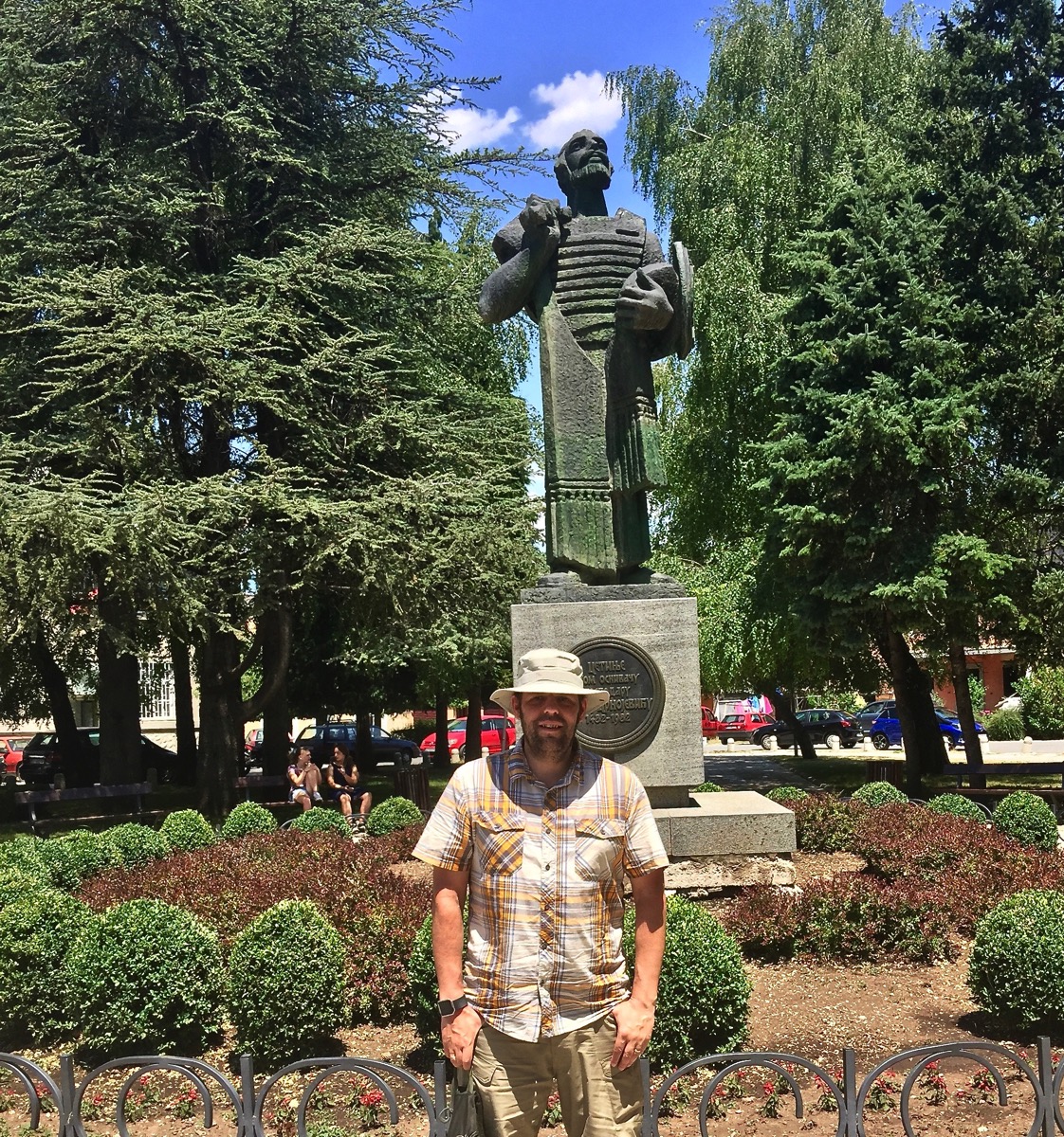 Me stood under a statue in montenegro